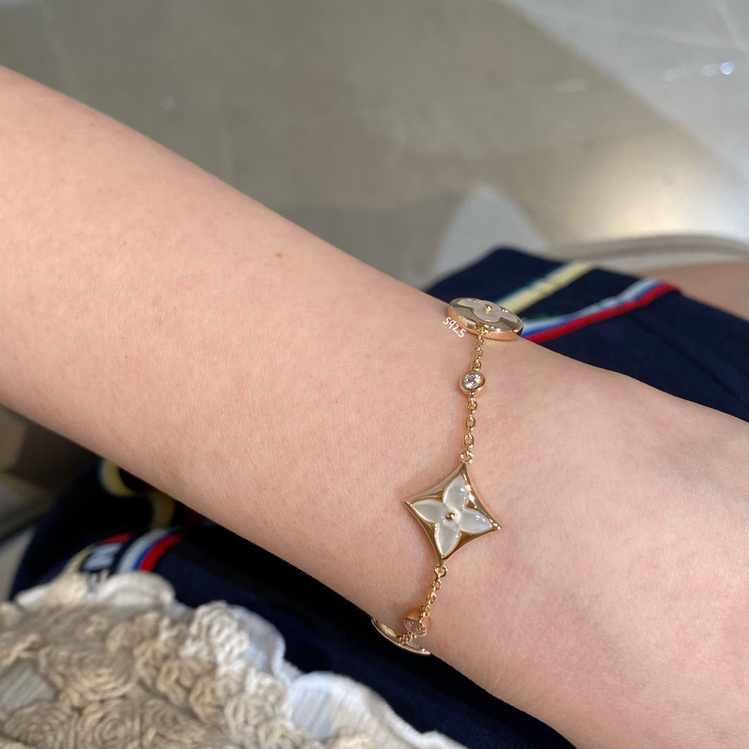 [Select]STAR AND SUN 4 MOTIF WHITE MOP PINK GOLD BRACELET